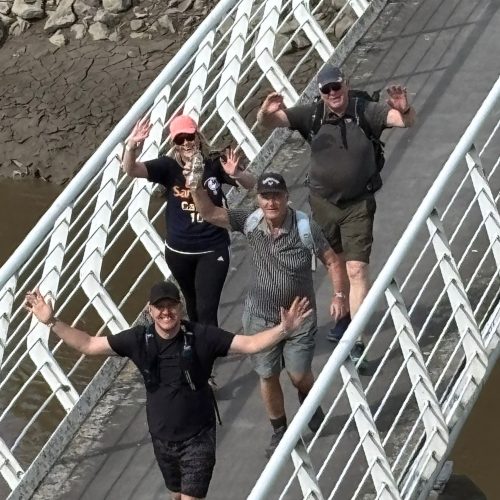 Giant Walkers going over Hale on Mersey bridge