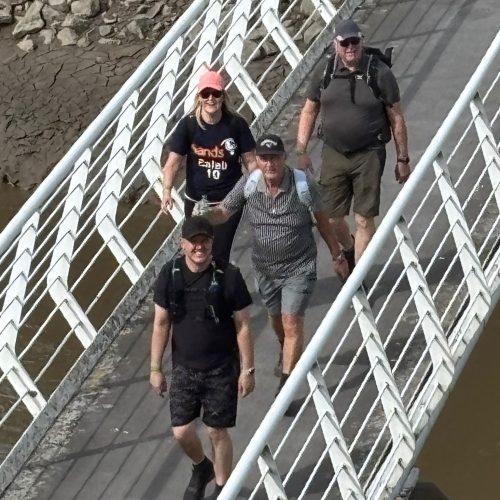 Giant Walkers going over Hale on Mersey bridge