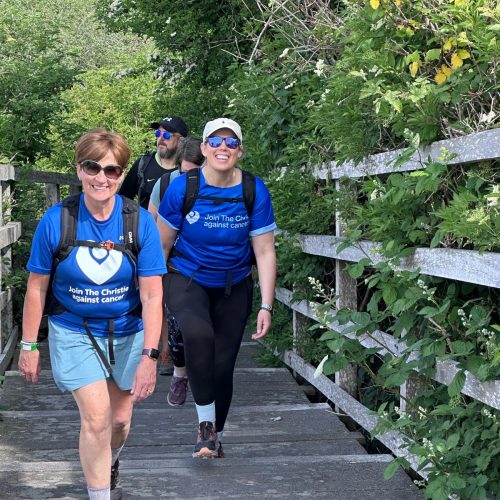 Giant Walkers trekking through Hale on Mersey
