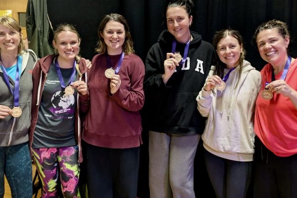 Trekkers celebrating with their medal at the end of the Giant Walk for CRY 2025. Hale2Hale.