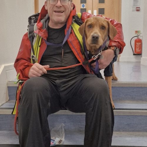 Tony McGuiness and his dog after completing the Giant Walk for Cry 2025 Hale2Hale.