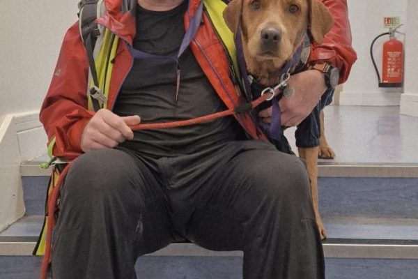 Tony McGuiness and his dog after completing the Giant Walk for Cry 2025 Hale2Hale.
