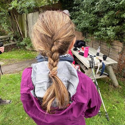 Young girl braids hair for MyIsrael charity walk.